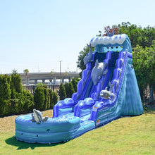 Load image into Gallery viewer, A blue inflatable water slide with a pool at the base, featuring a design that includes whitecaps and a dolphin motif.